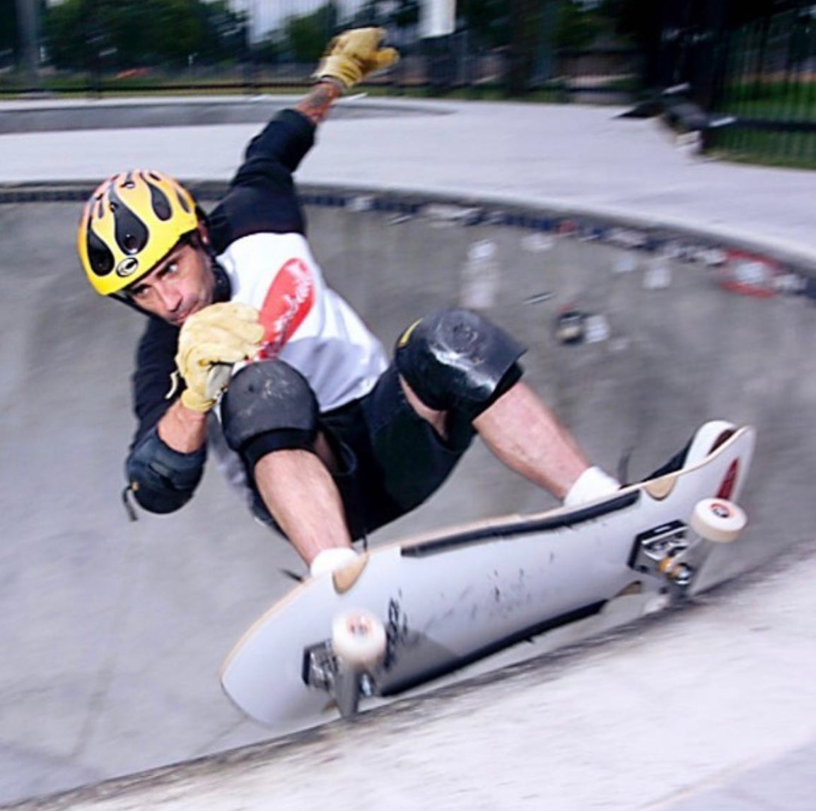 Skater riding the Jay Smith VI pro skateboard deck, white Formica bottom, in a concrete bowl – limited edition signed model