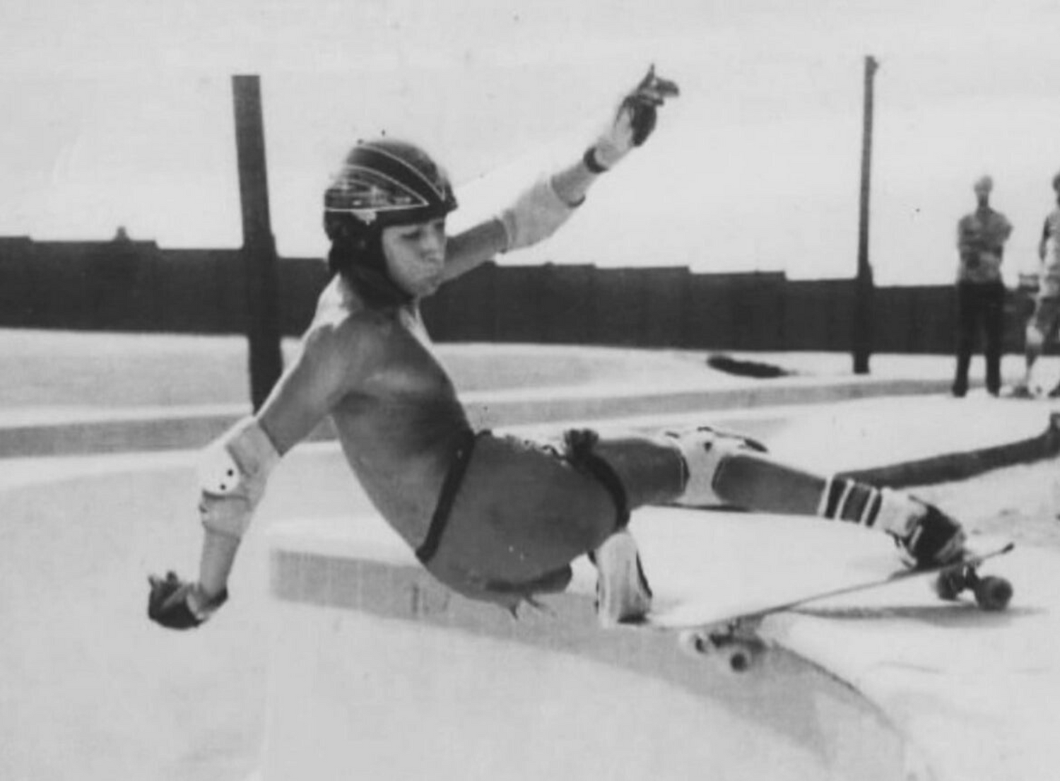 Psycho Dave Ortiz lays back on the pool coping during a classic Orange County backyard session.