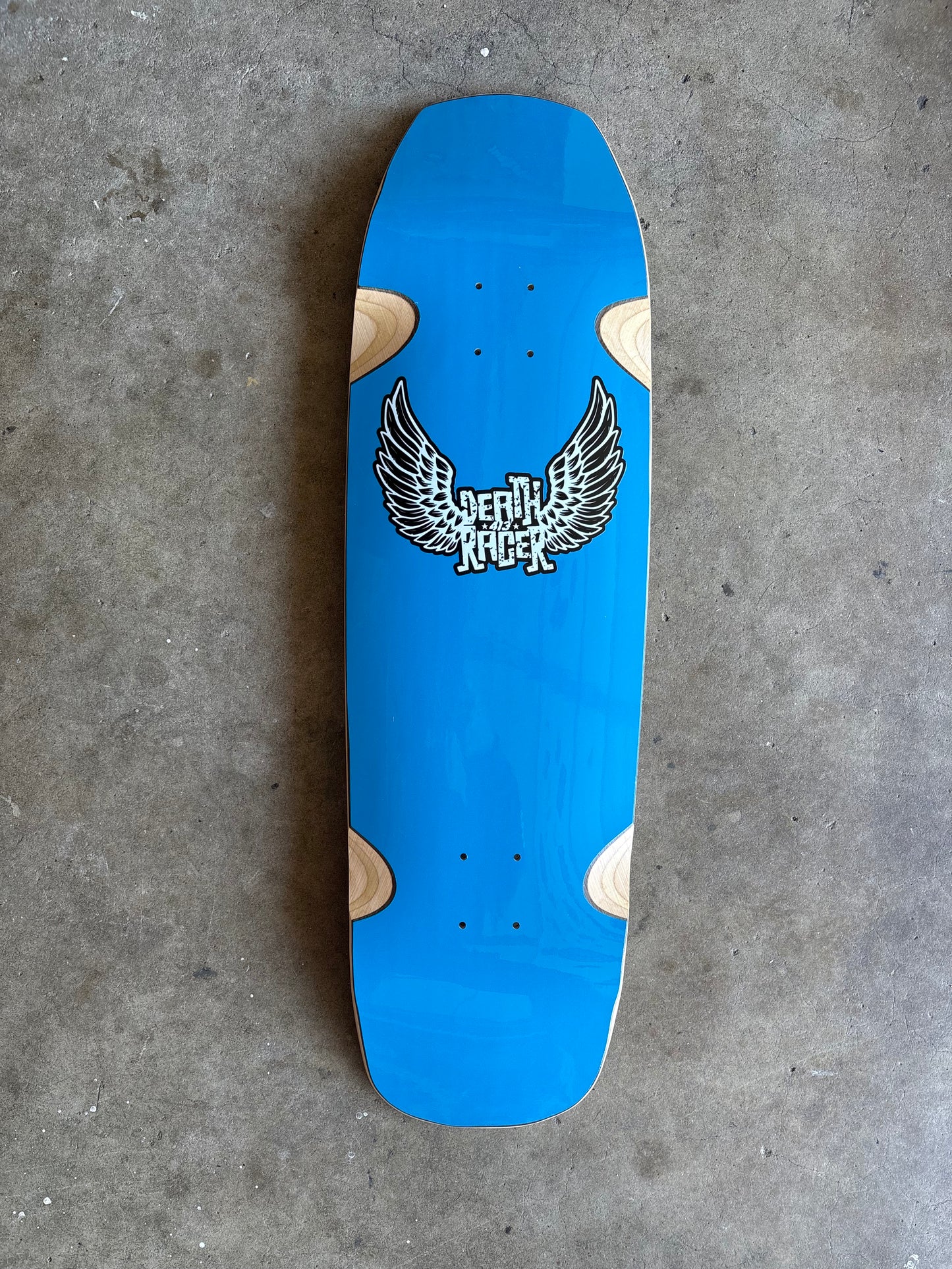 Skater Built x Death Racer 413 collaboration skateboard deck, matrix gloss blue with winged logo and 413 design