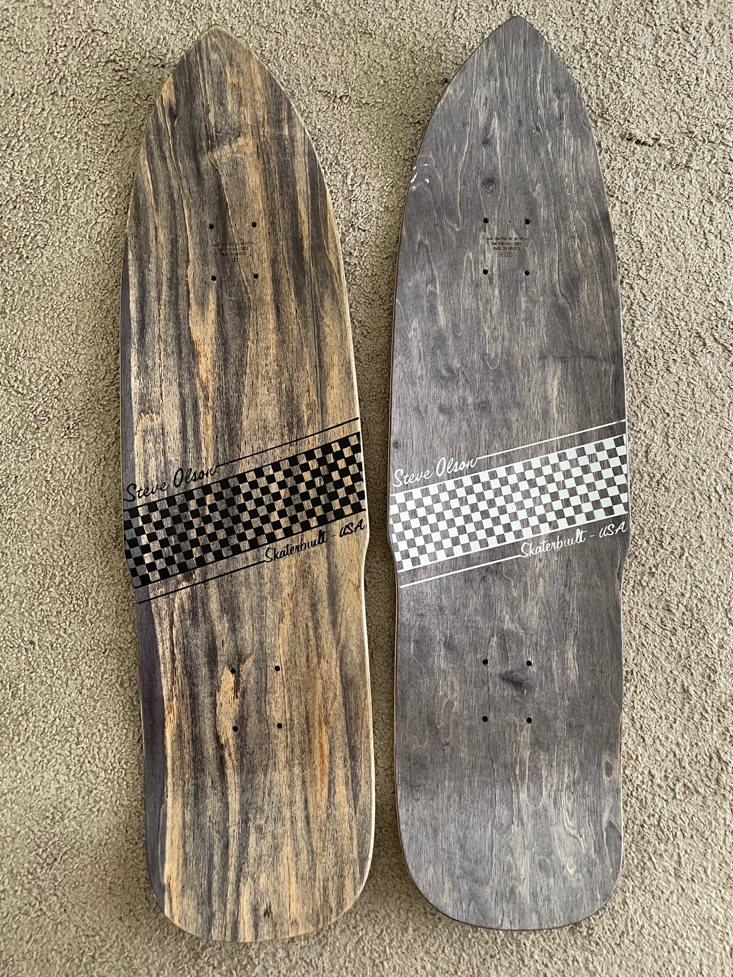 Top view of SkaterBuilt x Steve Olson Poolshark collaboration skateboard decks with wood finish and black and white checkered band