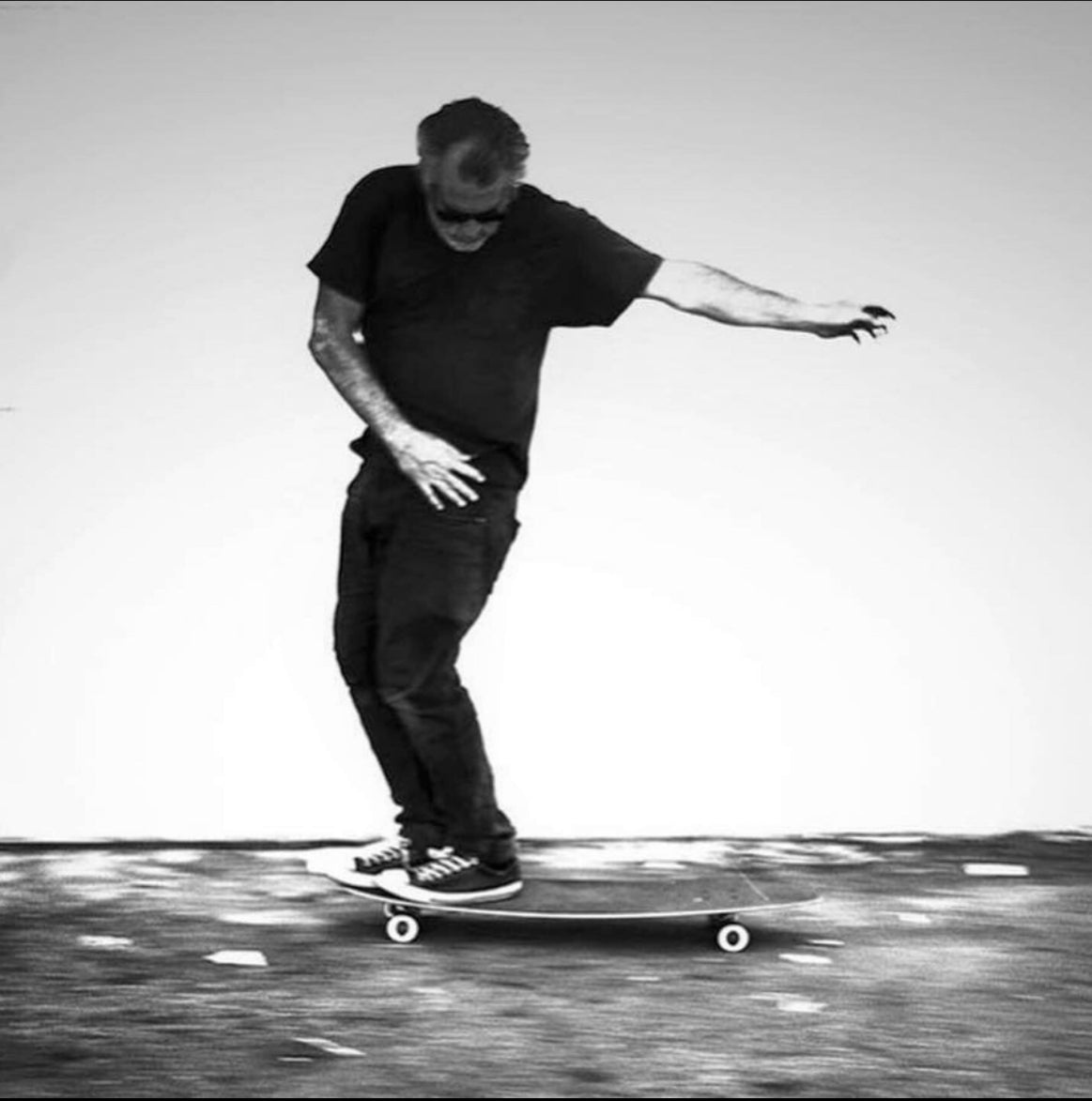 Black Skaterbuilt tee on male skateboarding model