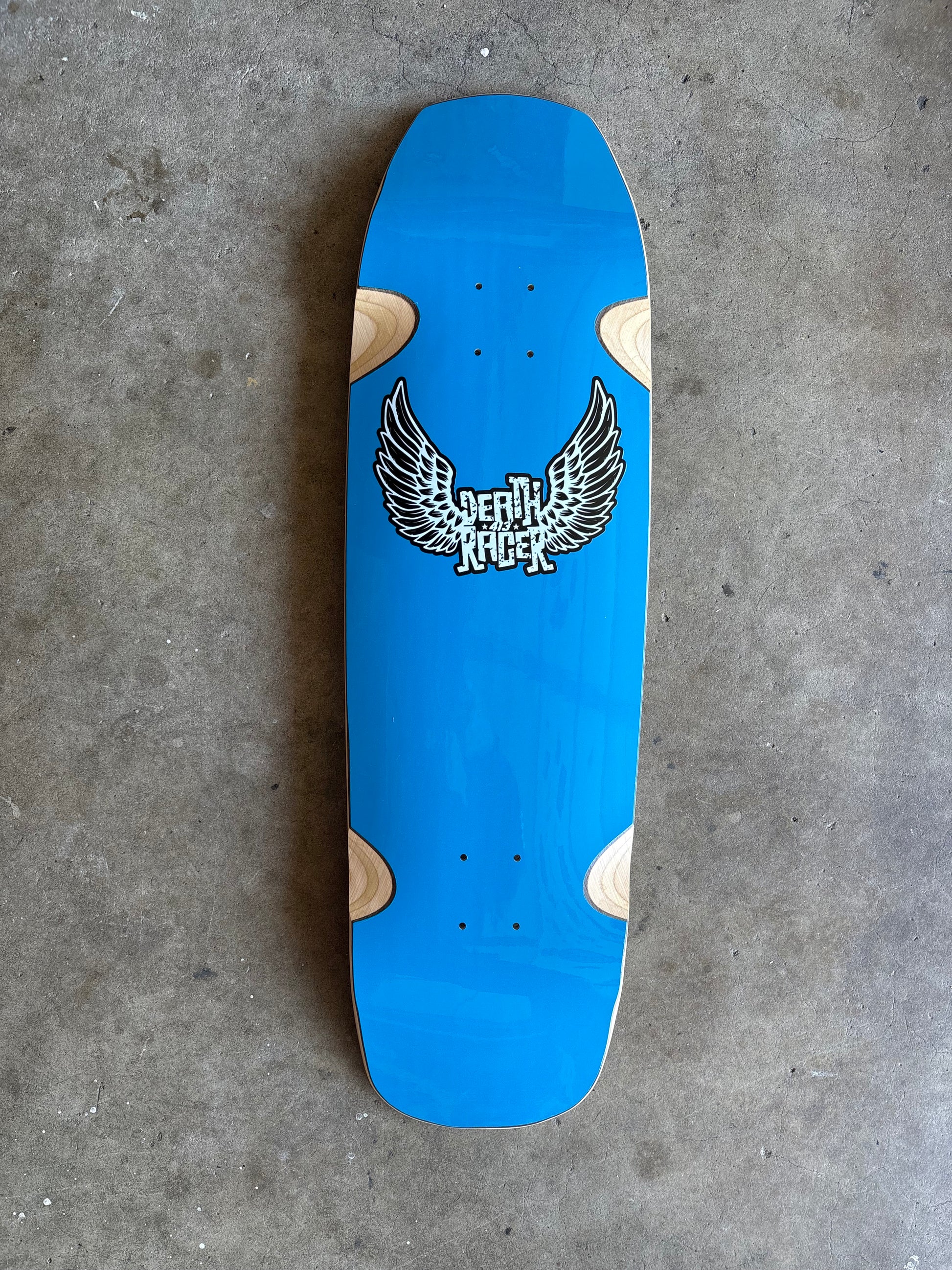 Skater Built x Death Racer 413 collaboration skateboard deck, matrix gloss blue with winged logo and 413 design